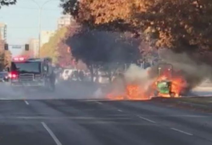 Fire crews arrive to put out a fire that overtook a riding lawn tractor in Richmond Wednesday.