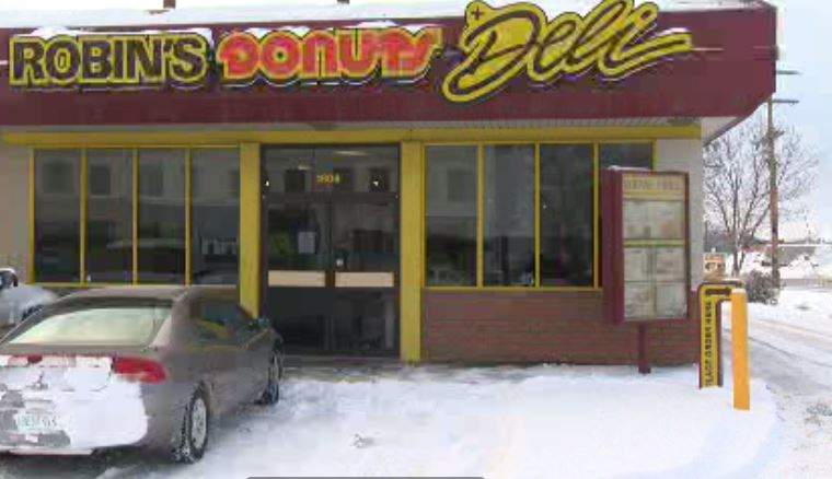 Regina Police are looking for a suspect after a coffee shop was robbed at gunpoint Friday evening. 
