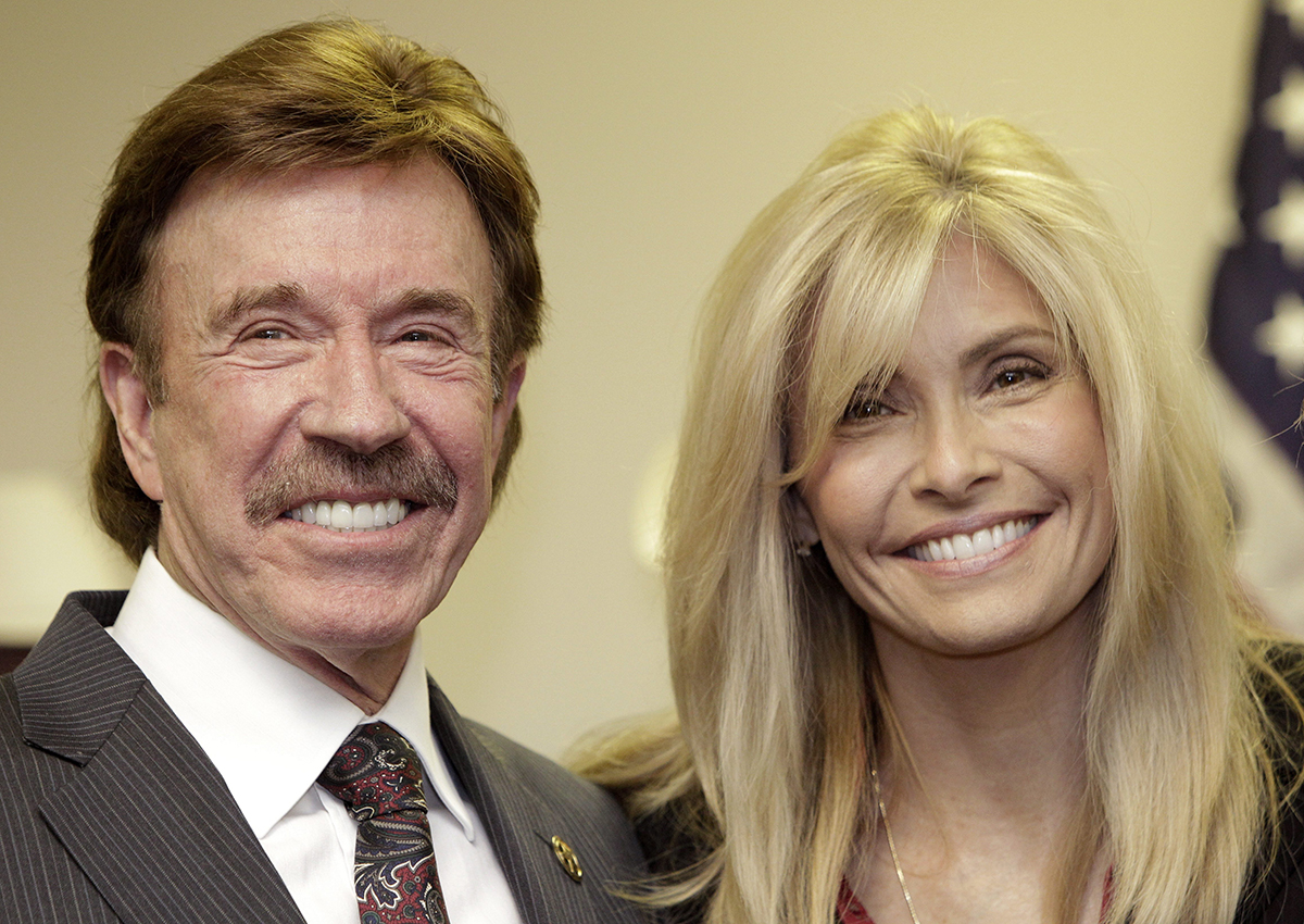  In this Dec. 2, 2010 file photo, actor Chuck Norris, left, and his wife Gena pose for a photo following a ceremony in Garland, Texas.