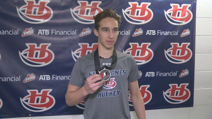 Dylan Cozens shows off his silver medal from the World Under-17 Hockey Challenge.