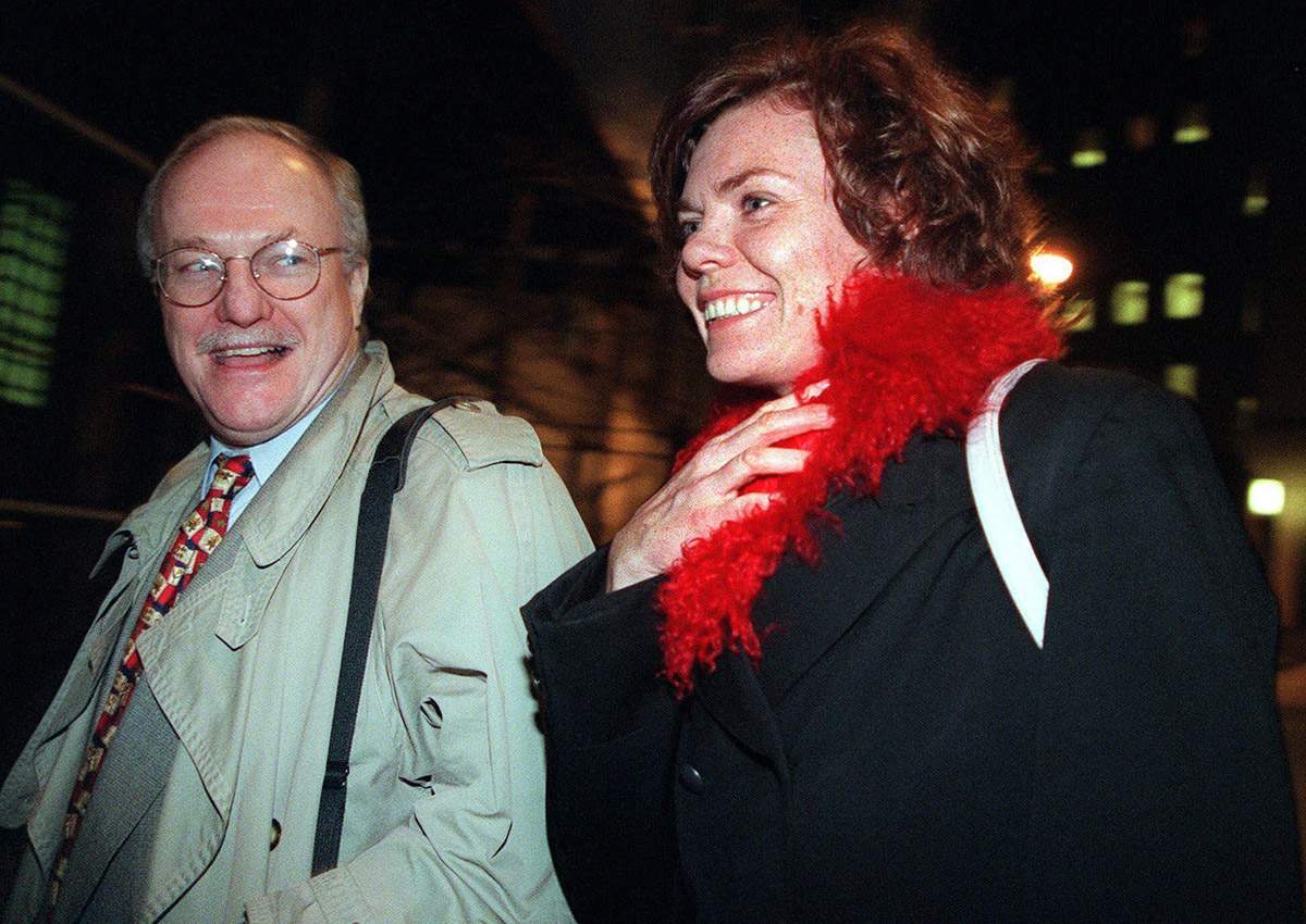 In this Dec. 7, 1999, file photo, attorney Michael Carey, left, and his client Anette Sorensen leave New York's U.S. District court after the second day of trial of her $20 million lawsuit against the city. 