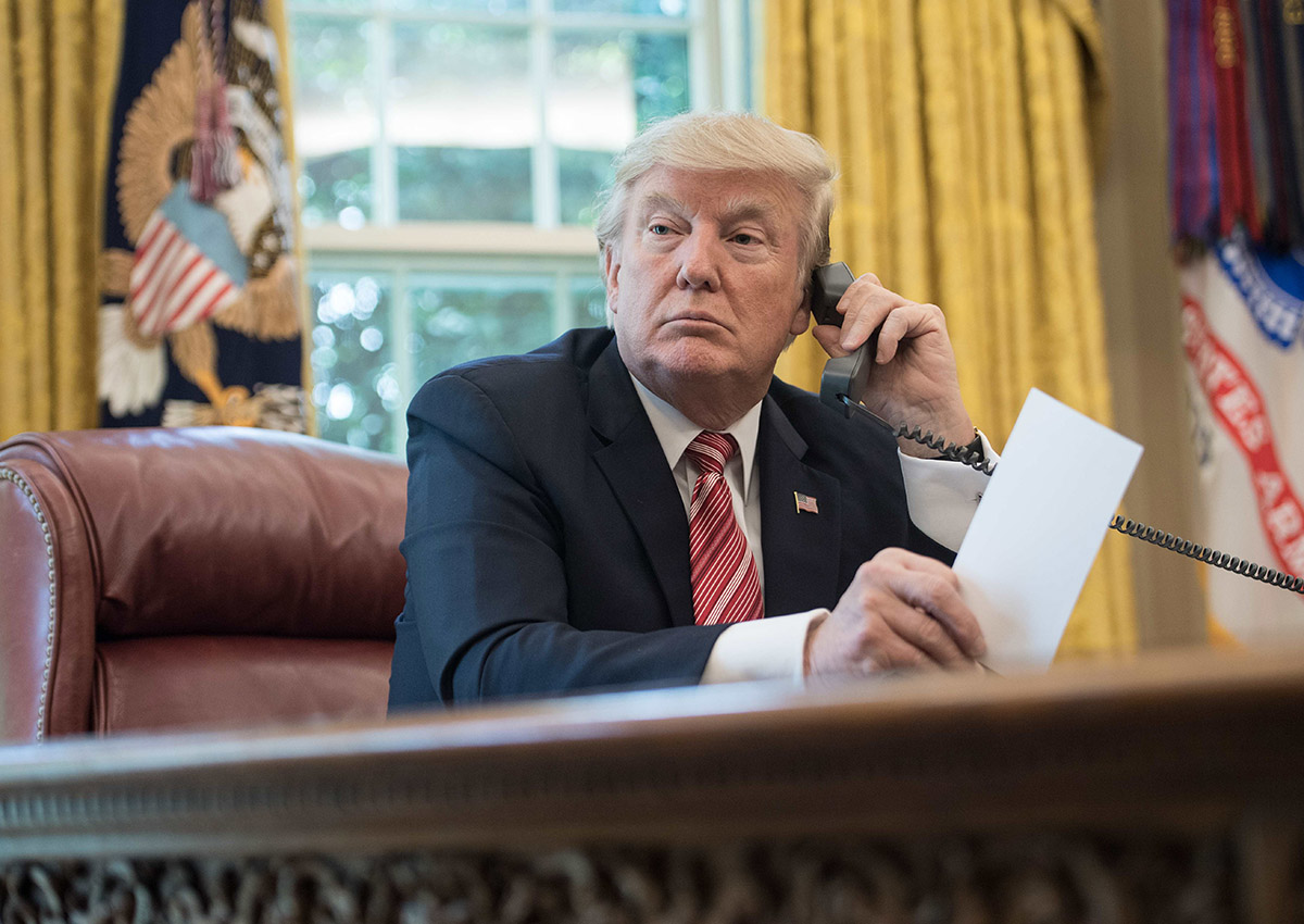 Donald Trump waits to speak on the phone.
