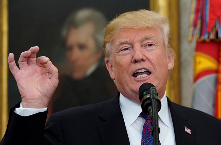 U.S. President Donald Trump gestures as he speaks at the White House in Washington, November 27, 2017.  