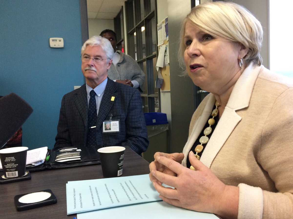Deputy Premier Deb Matthews announces anti-poverty funding in London, November 24, 2017, as Dan Ashbourne of the London Family Court Clinic, one of the recipient organizations to the funding, looks on.