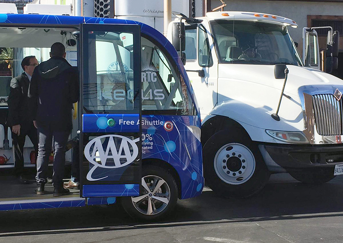 This photo by KVVU reporter Kathleen Jacob shows a driverless shuttle bus after it collided with a big rig in Las Vegas Wednesday, Nov. 8, 2017, less than two hours after the automated ride service was launched.