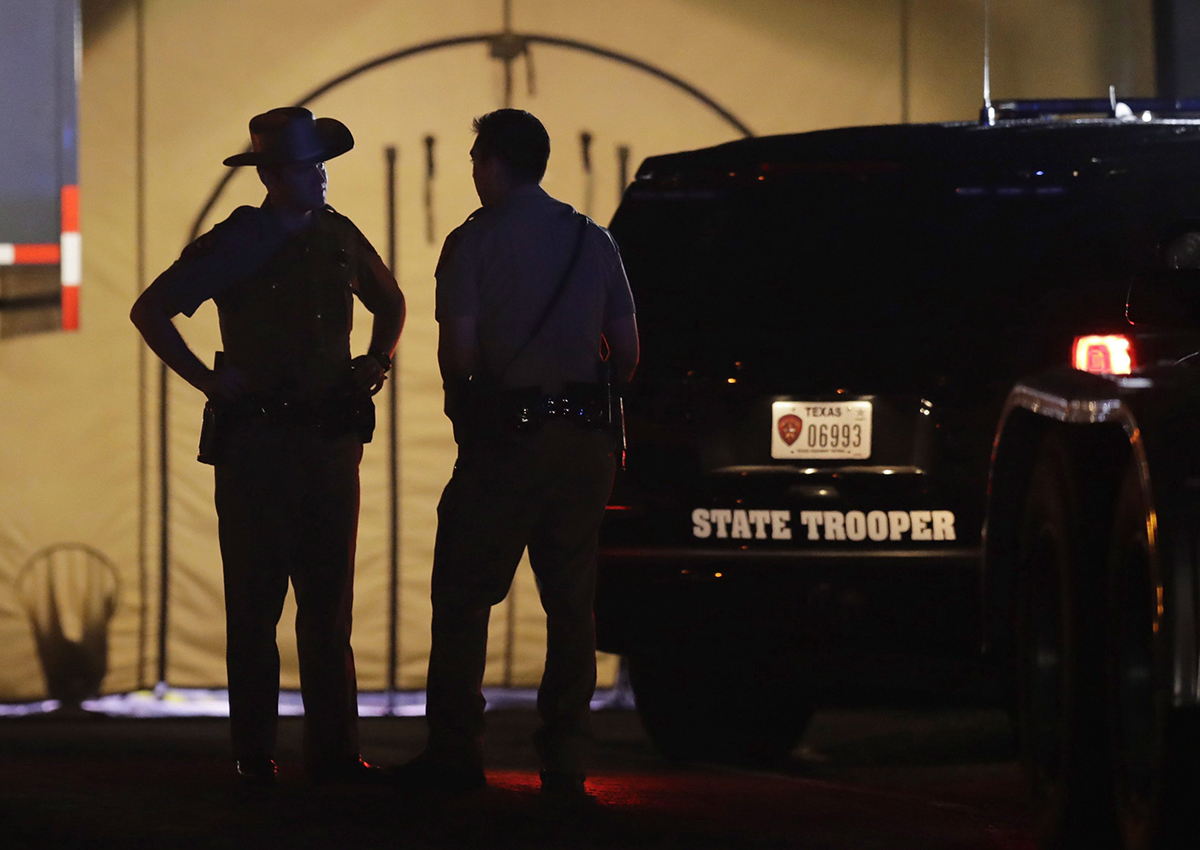 Law enforcement officials work at the scene of a shooting at the First Baptist Church of Sutherland Springs, Sunday, Nov. 5, 2017, in Sutherland Springs, Texas. 