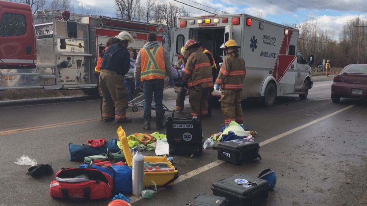 First responders attend to an injured flag person Friday on Highway 6 east Vernon. 