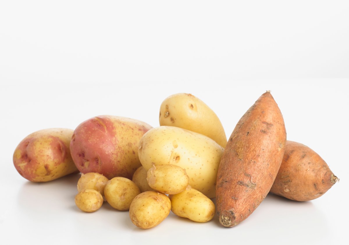 Selection of potatoes and sweet potatoes.