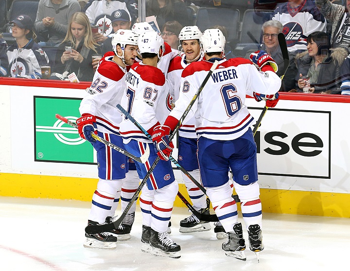 Jonathan Drouin, Artturi Lehkonen, Max Pacioretty, Andrew Shaw and Shea Weber of the Montreal Canadiens celebrate a second period goal against the Winnipeg Jets at Bell MTS Place on Nov. 4, 2017.