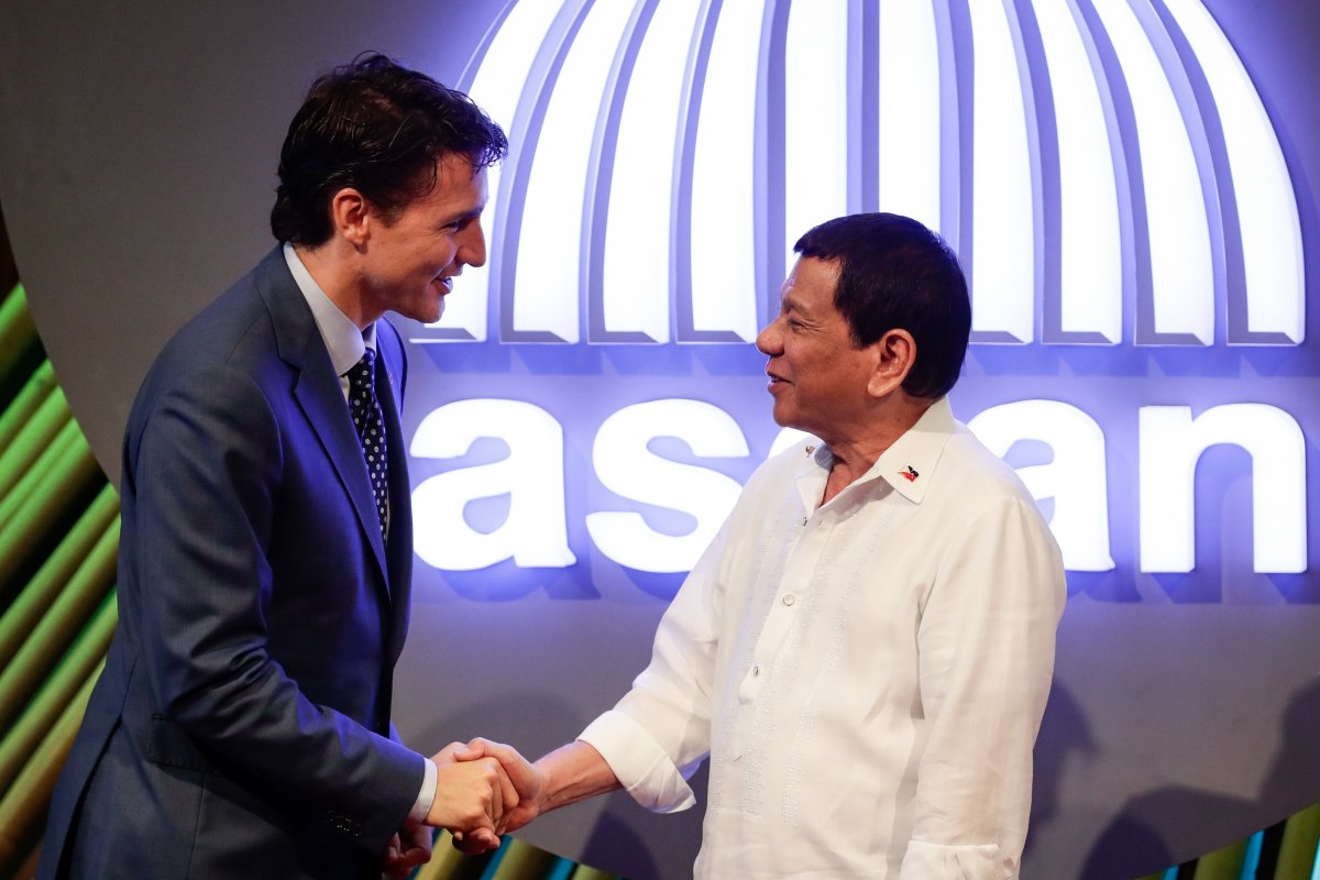 Prime Minister Justin Trudeau shakes hands with Philippine President Rodrigo Dutertebefore the opening ceremony of the 31st Association of Southeast Asian Nations (ASEAN) Summit in Manila on November 13, 2017. Duterte says he is cancelling a deal to buy helicopters from Canada, after the Trudeau government announced it would be subject to a human rights review.