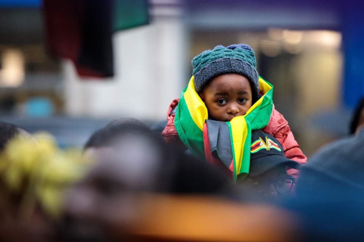 Protesters demonstrate outside the Embassy of Zimbabwe in London on Nov. 18, 2017 in anticipation of President Robert Mugabe’s resignation. (Photo by Jack Taylor/Getty Images)