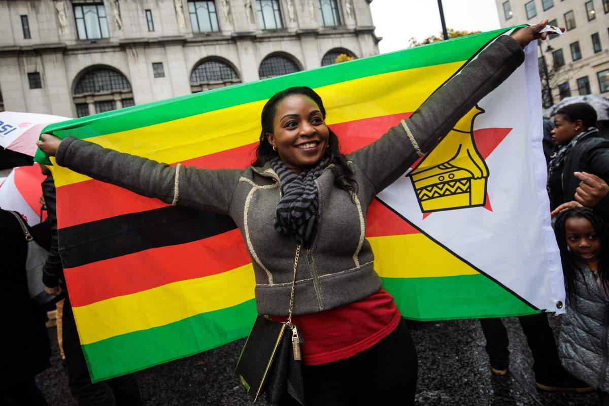 Protesters demonstrate outside the Embassy of Zimbabwe in London to call on the leader of the country Robert Mugabe to resign on November 18, 2017 in London, England. (Photo by Jack Taylor/Getty Images)