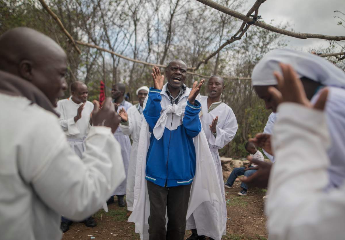 Apostolic Christians conduct a religious service in a piece of open land in the capital city of Harare, Zimbabwe on November 19, 2017.A day after huge crowds rallied peacefully in the capital for 93-year-old President Robert Mugabe to step down (Photo by Belal Khaled/NurPhoto via Getty Images)