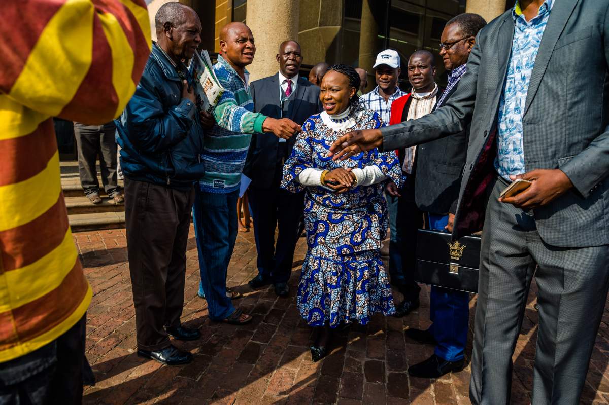 The wife of new president of the ruling ZANU-PF party, Auxilia Mnangagwa is congratulated on her reinstatement to the party on November 19, 2017 in Harare.(JEKESAI NJIKIZANA/AFP/Getty Images)