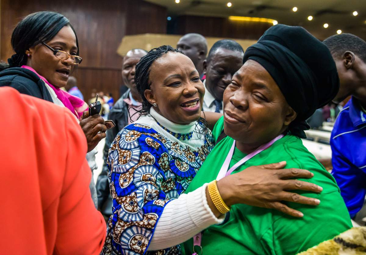 The wife of new president of the ruling ZANU-PF party, Auxilia Mnangagwa (C) is congratulated on her reinstatement to the party on November 19, 2017 in Harare.( JEKESAI NJIKIZANA/AFP/Getty Images)