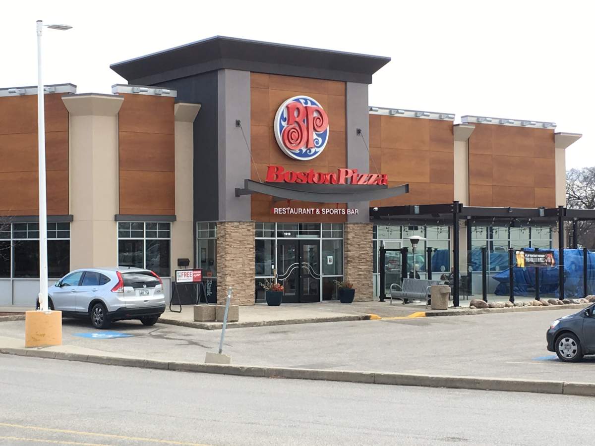 Officers arrested three heavily armed men at a Boston Pizza in Winnipeg's St. Vital area. 
