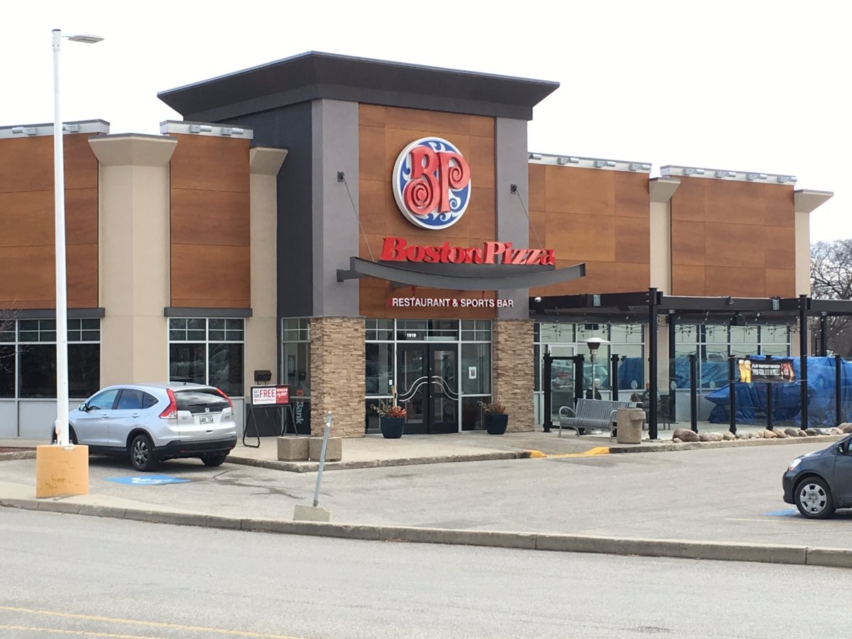 Officers arrested three heavily armed men at a Boston Pizza in Winnipeg's St. Vital area. 