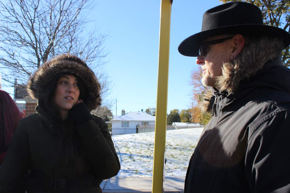 Fanshawe student and rally organizer Bethany Baglieri speaks with OPSEU Local 110 Secretary Whitney Hoth.