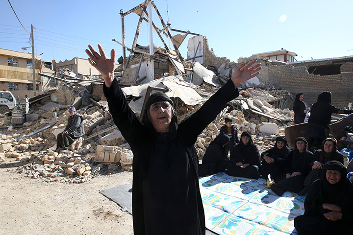A woman mourns following an earthquake in Sarpol-e-Zahab in western Iran.