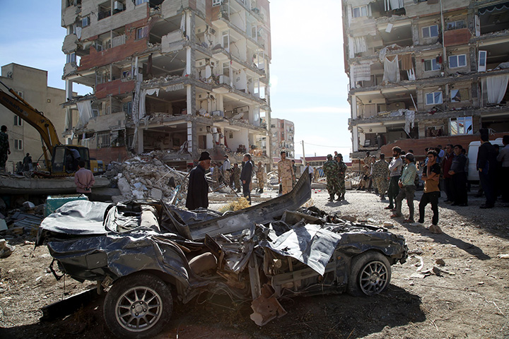 People inspect the debris in Kermanshah, Iran following an earthquake on November 13, 2017.