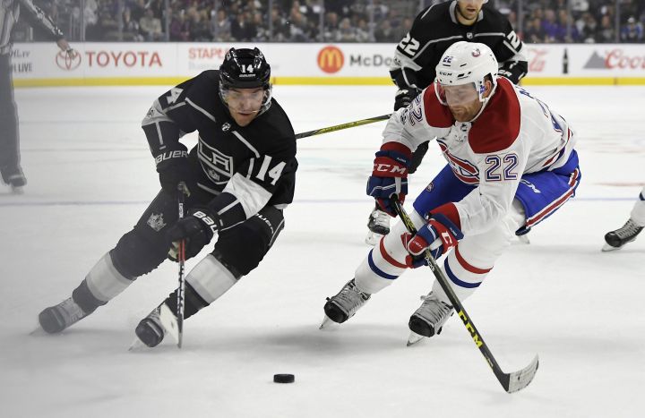 Los Angeles Kings forward Michael Cammalleri, left, and Montreal Canadiens defenceman Karl Alzner vie for the puck during the second period of an NHL hockey game, Wednesday, Oct. 18, 2017, in Los Angeles. 