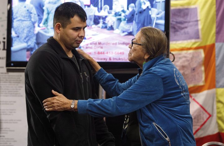 Paul Tuccaro is consoled by an elder after giving testimony during the National Inquiry into Missing and Murdered Indigenous Women and Girls, in Edmonton Alta, on Tuesday November 7, 2017. Tuccaro’s sister Amber Tuccaro went missing in 2010.