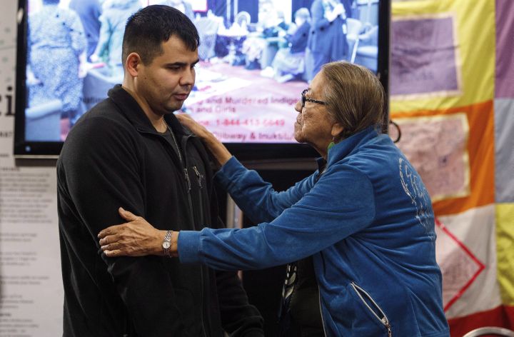 Paul Tuccaro is consoled by an elder after giving testimony during the National Inquiry into Missing and Murdered Indigenous Women and Girls, in Edmonton Alta, on Tuesday November 7, 2017. Tuccaro's sister Amber Tuccaro went missing in 2010. 