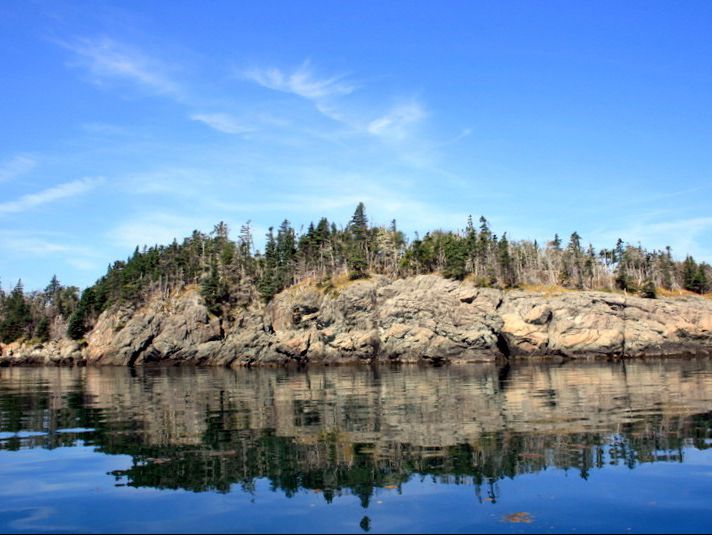 An island for sale in New Brunswick is shown in a handout photo. It sounds like a spectacular buy: A 100-hectare island with two houses and several private beaches on the scenic Bay of Fundy, all for less than the price of a Toronto or Vancouver bungalow.