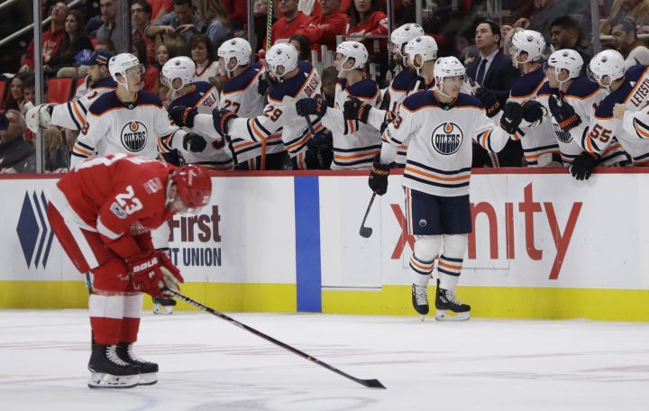 Edmonton Oilers centre Ryan Strome, right, and right wing Jesse Puljujarvi, left, celebrate a goal with teammates as Detroit Red Wings centre Scott Wilson (23) skates back to the bench during the second period of an NHL hockey game, Wednesday, Nov. 22, 2017, in Detroit.