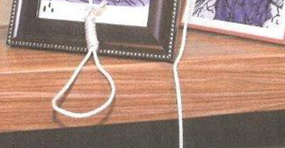 City of Miami Department of Fire-Rescue photo shows the frame of a family photo of one of the employees that was defaced with lewd and sexually explicit renderings and adorned with a noose in this image released in Miami, Florida, U.S., November 2, 2017.