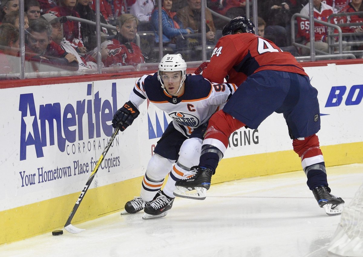 Edmonton Oilers center Connor McDavid (97) skates with the puck against Washington Capitals defenseman Brooks Orpik (44) during the first period of an NHL hockey game, Sunday, Nov. 12, 2017, in Washington. (AP Photo/Nick Wass).