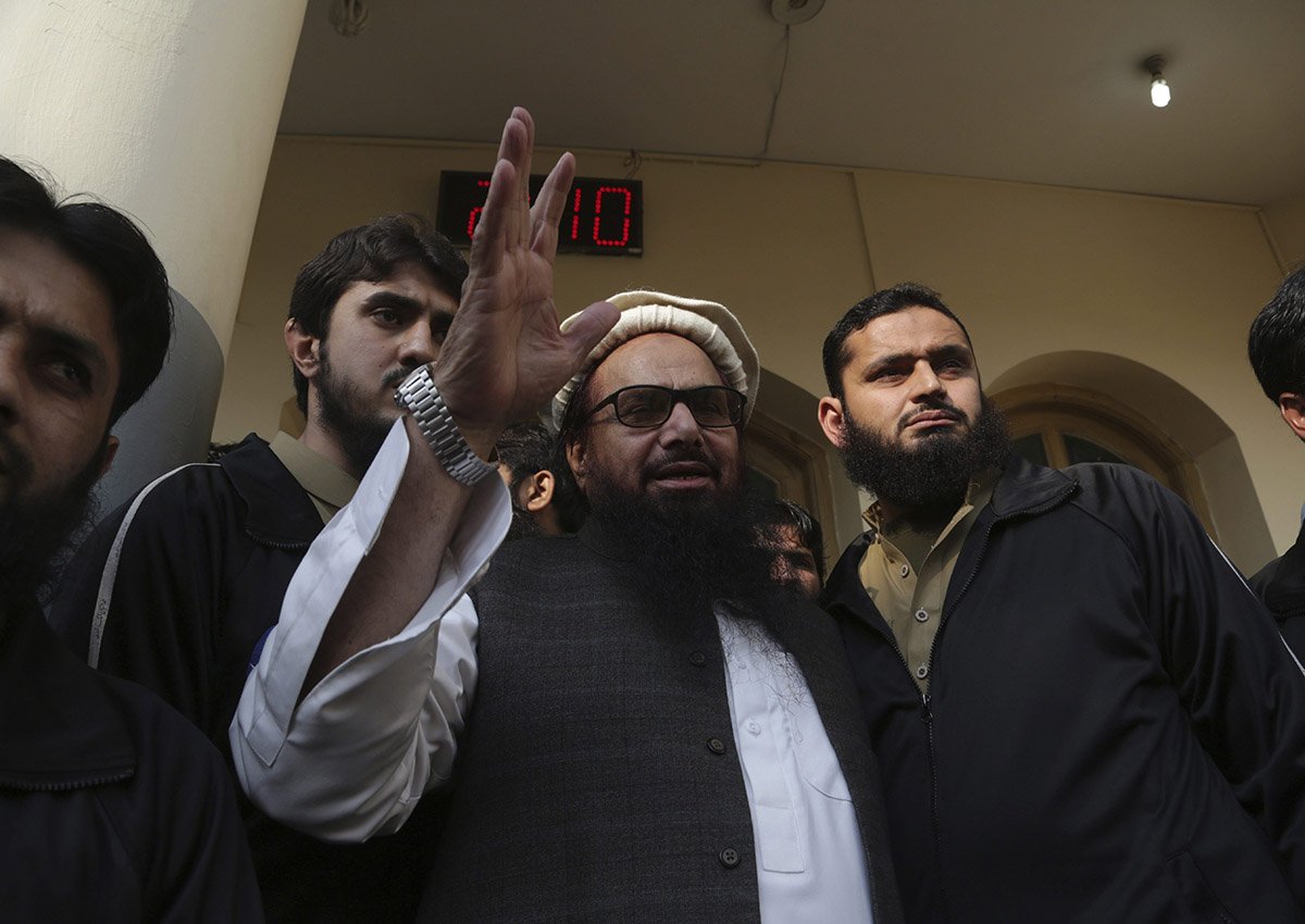 Hafiz Saeed, head of the Pakistani religious party, Jamaat-ud-Dawa, waves to his supporters at a mosque in Lahore, Pakistan, Friday, Nov. 24, 2017. 