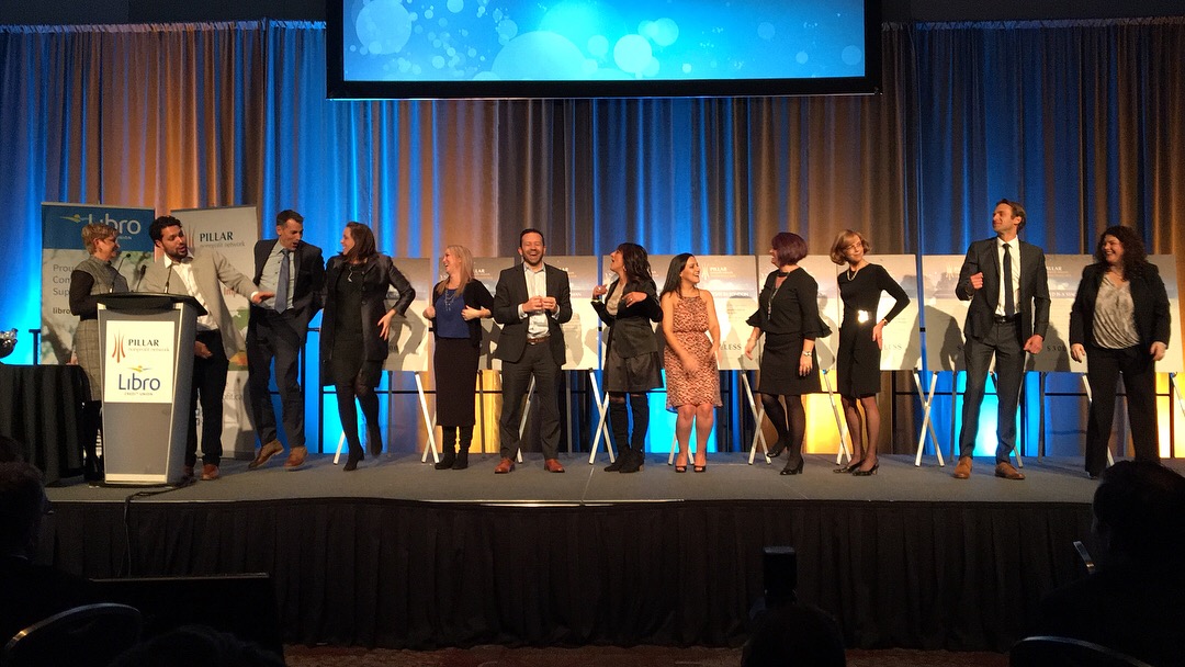 Attendees take part in the boisterous Heads or Tails fundraiser at the 11th annual Pillar Community Innovation Awards.