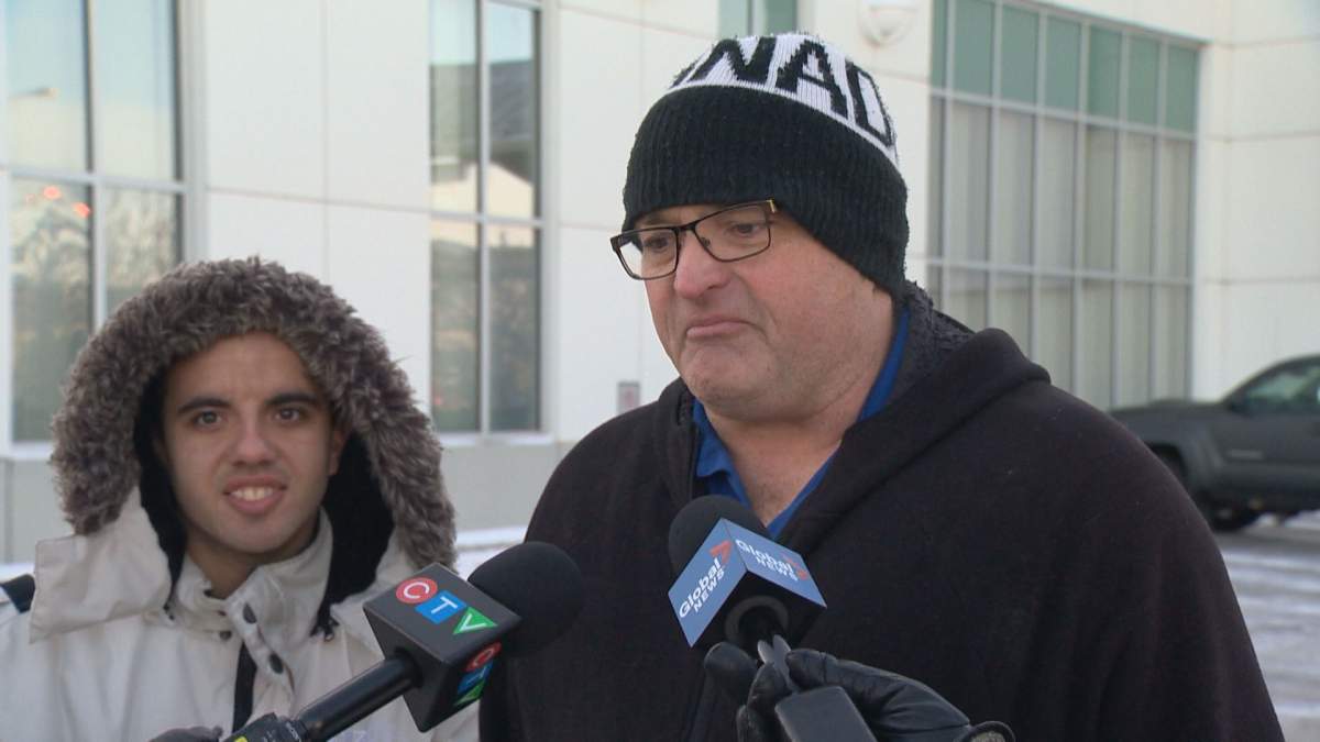 Dylan Morin (right) and Ken Grey discuss the Saskway Co-operative Bus Service.