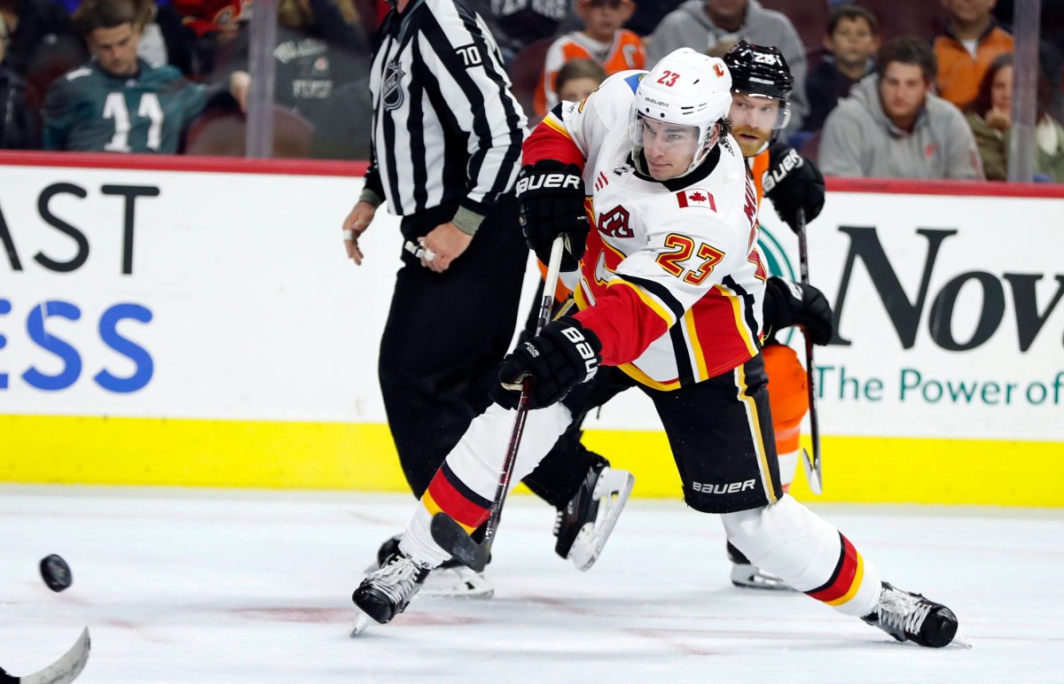 Calgary Flames' Sean Monahan shoots the puck during the third period of an NHL hockey game against the Philadelphia Flyers, Saturday, Nov. 18, 2017, in Philadelphia. The Flames won 5-4 in overtime. (AP Photo/Chris Szagola).