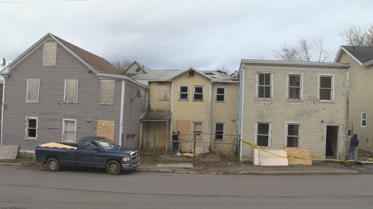 Investigators are still trying to determine the cause of a fire at three vacant buildings in Saint John on Tuesday morning.