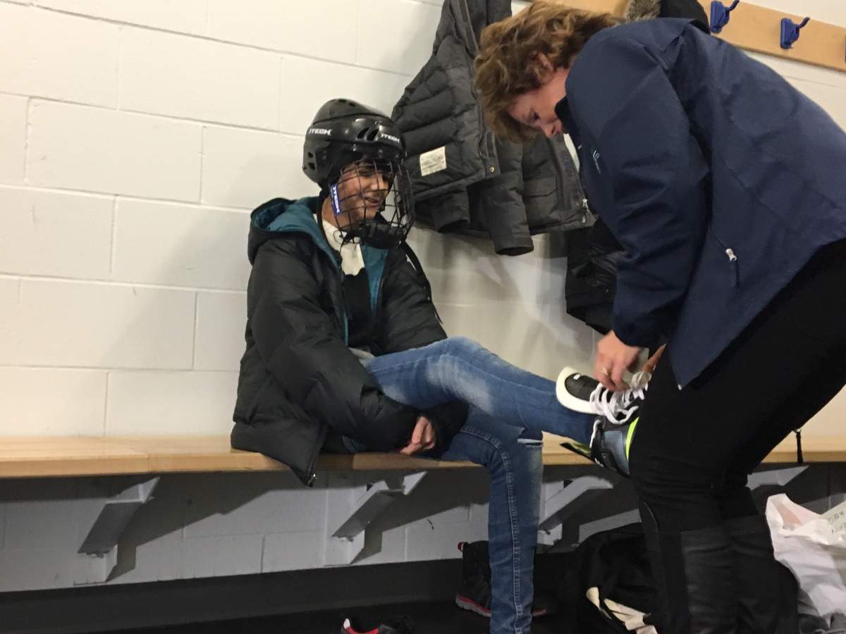 Majd Hamrasho learns to skate with the help of Margie Reis with Seven Oaks Sportsplex.