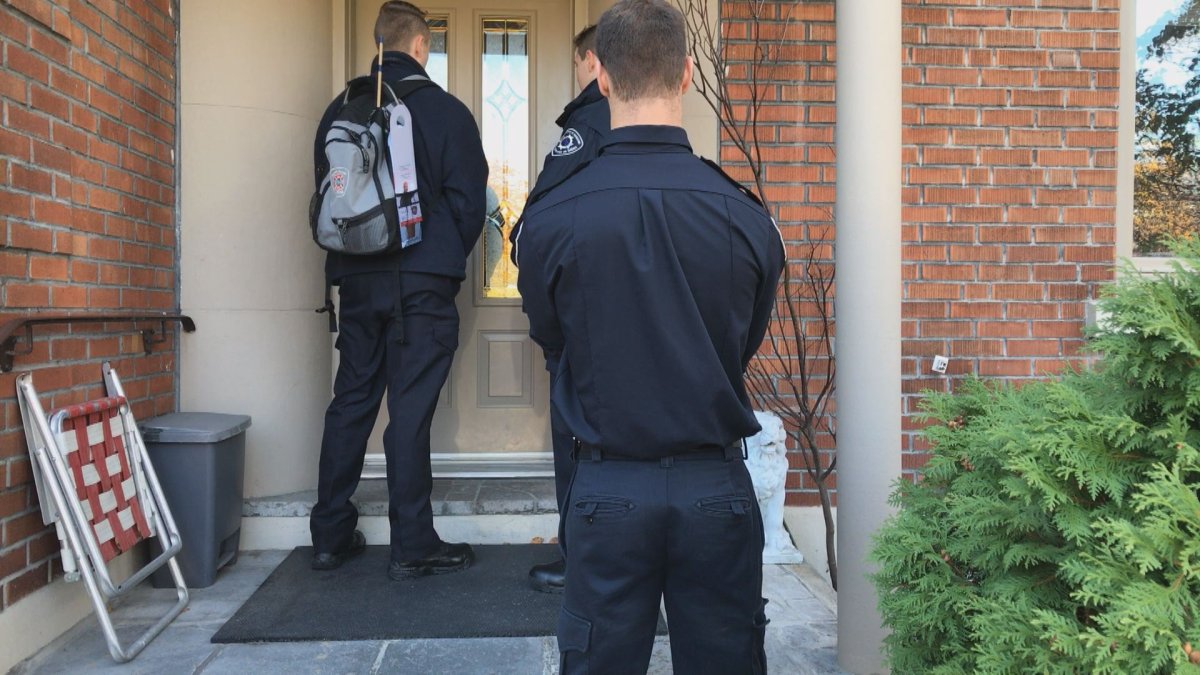 Montreal fiefighters and students go door-to-door to remind residents to change the batteries on their smoke detectors. Saturday, Nov. 4, 2017.