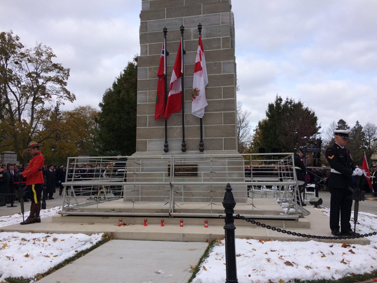 Troops stand guard at the cenotaph in Victoria Park during the Remembrance Day ceremony. 
