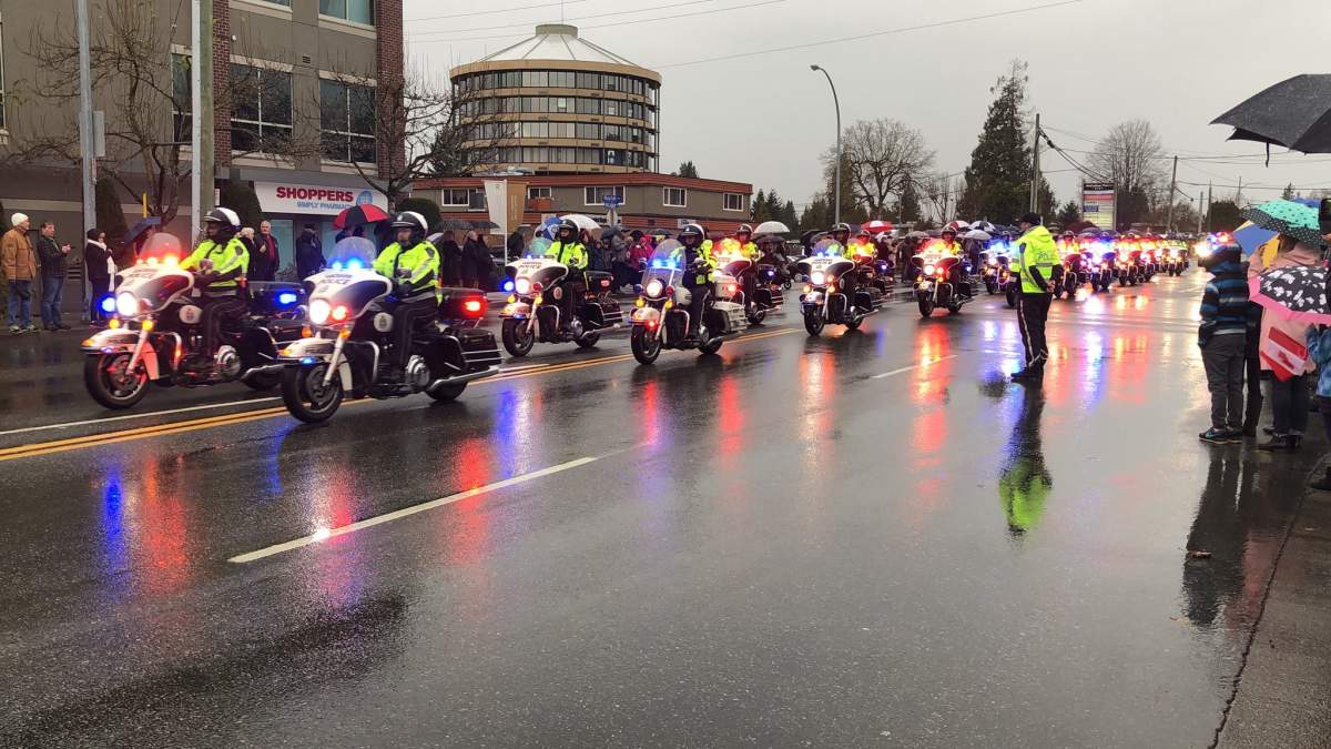 Vancouver Police motorcycles help lead the procession.