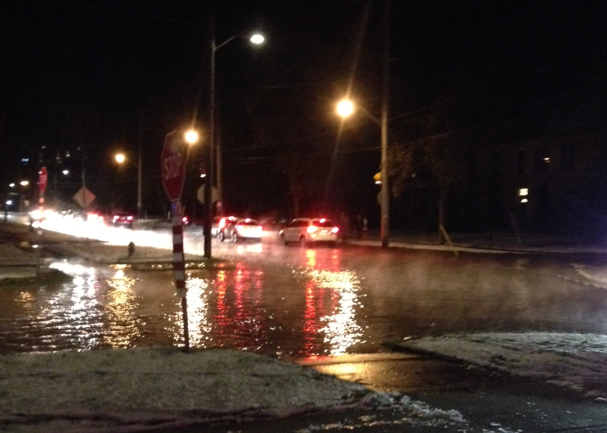 A damaged fire hydrant is flooding Waterloo Street between Central Avenue and Pall Mall Street Friday night.
