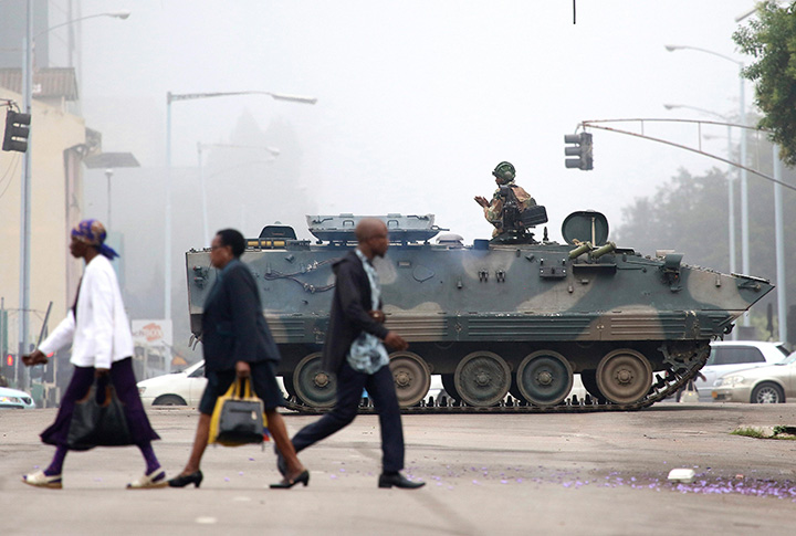 An armed soldier patrols a street in Harare, Zimbabwe, Wednesday, Nov. 15, 2017.