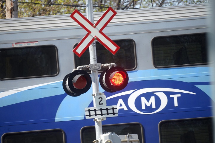 In this file photo, an AMT commuter train, now known as the RTM, is seen at a road crossing, Que., May 3, 2015.