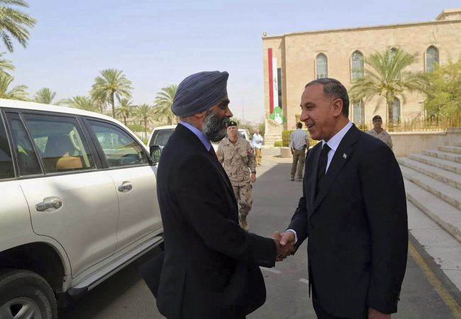 Canadian Defense Minister Harjit Singh Sajjan is welcomed by Iraqi Defense Minister Khaled al-Obeidi on his arrival to the Iraqi Ministry of Defense in Baghdad, Iraq, July 11, 2016.