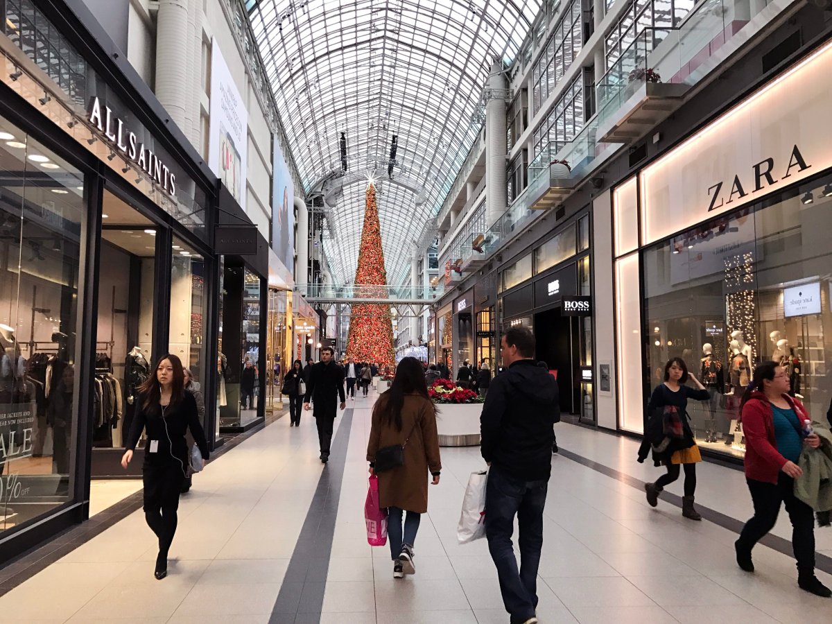 People shop at CF Toronto Eaton Centre a few days before Christmas, Toronto Ont., Dec. 22, 2016. 