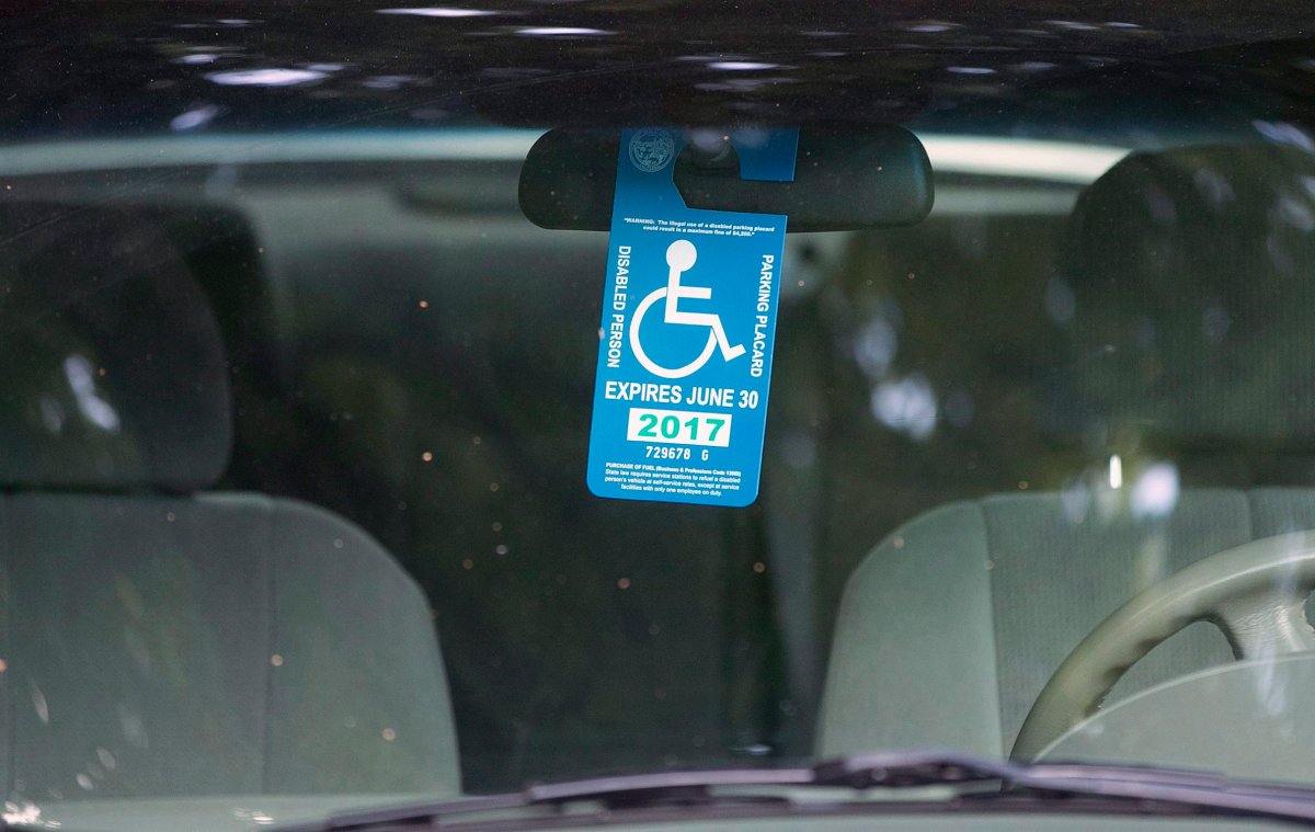 A handicapped placard hangs in a vehicle parked by the Capitol Tuesday, April 18, 2017, in Sacramento, Calif.