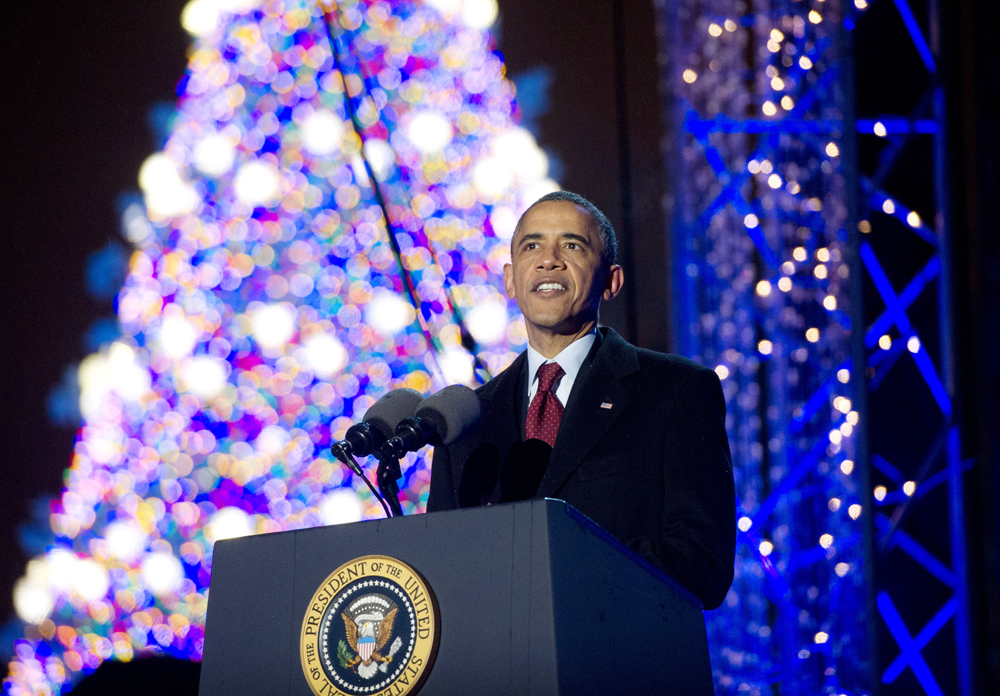 US. President Barack Obama speaks during the National Christmas Tree lighting ceremony in Washington, DC, December 6, 2013. ).