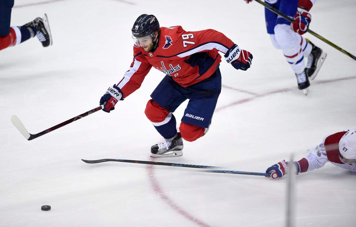 Washington Capitals left wing Nathan Walker (79), of Australia, chases the puck past Montreal Canadiens left wing Max Pacioretty (67) during the third period of a NHL hockey game, Saturday, Oct. 7, 2017, in Washington.