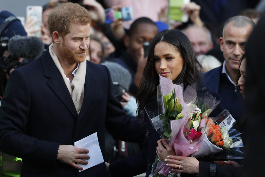 Britain's Prince Harry and his fiancee Meghan Markle arrive at a charity fair in Nottingham, England, Friday, Dec. 1, 2017. 