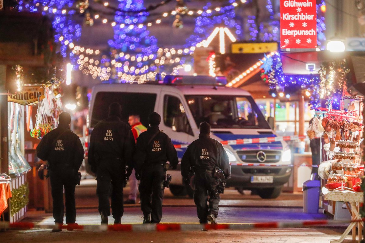 Policemen walk on an empty Christmas market after it was evacuated by police, in Potsdam, Germany, 01 December 2017.
